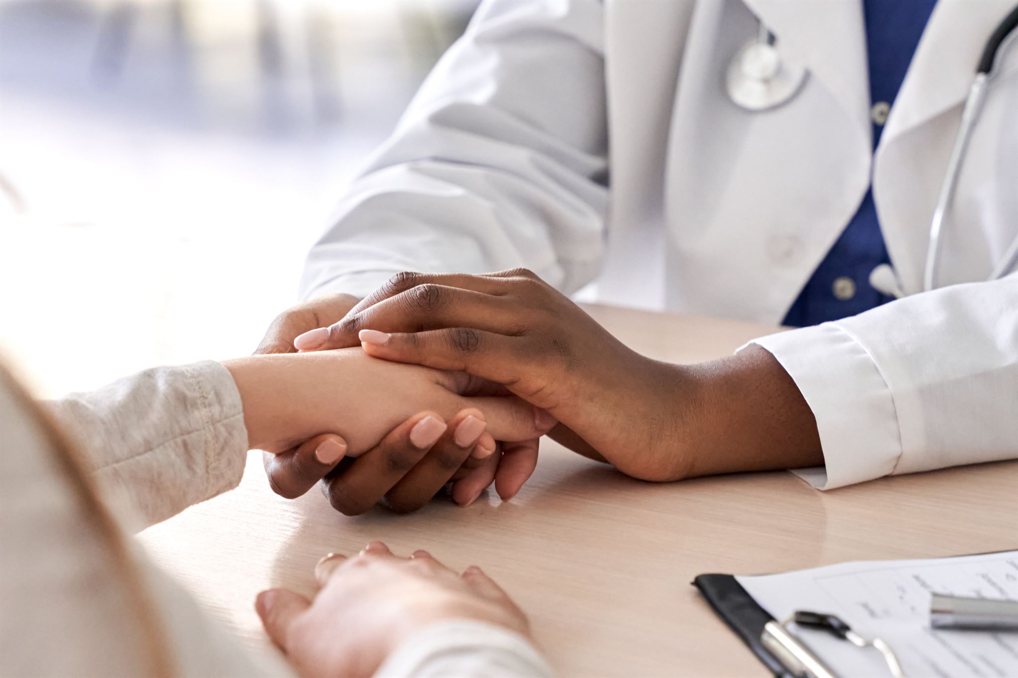 Handshake between healthcare colleagues symbolizing collaboration