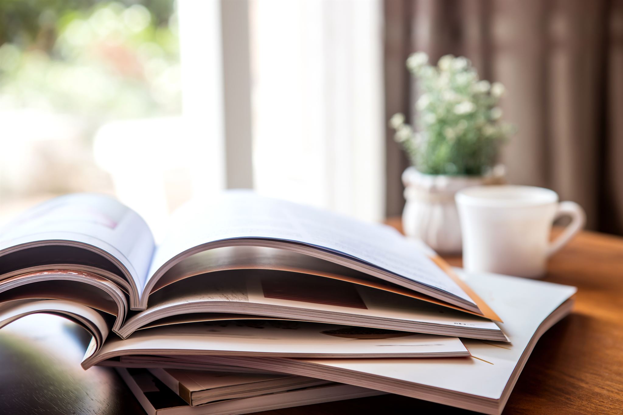 Open policy handbook on desk with notes